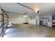 A large three-car garage with washing machine, utility sink and two doors at 1351 Washington Dr, Englewood, FL 34224