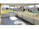 Screened lanai with views of the yard at 1351 Washington Dr, Englewood, FL 34224