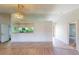 Bright living room with an open floor plan and a pass through to the kitchen at 1351 Washington Dr, Englewood, FL 34224