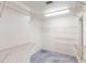 This walk-in closet has wire shelving and blue carpeting at 1351 Washington Dr, Englewood, FL 34224