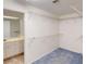 Bright walk-in closet features wire shelving and a view into the bathroom at 1351 Washington Dr, Englewood, FL 34224