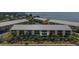 Overview of the waterfront condo complex with beach access and lush tropical landscaping at 14459 River Beach Dr # 112, Port Charlotte, FL 33953