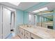 Spacious bathroom features a large vanity with a big mirror and a shower/tub combination at 14459 River Beach Dr # 112, Port Charlotte, FL 33953