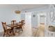 Cozy dining area with hardwood floors, chandelier, and decorative accents at 14459 River Beach Dr # 112, Port Charlotte, FL 33953
