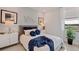 Bright bedroom features a large window, stylish decor, and a comfortable bed at 15968 Crofton Springs Way, Port Charlotte, FL 33953