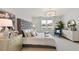 Elegant bedroom showcasing a luxurious bed, stylish decor, and a bright window with natural light at 15968 Crofton Springs Way, Port Charlotte, FL 33953