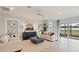 Inviting living room with neutral tones, comfortable seating, modern decor, and access to the backyard patio at 15968 Crofton Springs Way, Port Charlotte, FL 33953