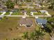 Aerial view of a home and its neighborhood showing community landscape and surrounding properties at 16094 Ortega Dr, Punta Gorda, FL 33955