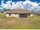 Enjoy the spacious backyard featuring a screened patio, perfect for outdoor entertaining and relaxation at 16094 Ortega Dr, Punta Gorda, FL 33955