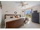 Guest bedroom with two twin beds, wood furniture, and ceiling fan at 16094 Ortega Dr, Punta Gorda, FL 33955