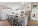 Spacious kitchen with white cabinetry, stainless steel appliances, and an oversized island at 16094 Ortega Dr, Punta Gorda, FL 33955