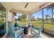 Relax and unwind in the screened patio with comfortable seating and scenic backyard views at 16094 Ortega Dr, Punta Gorda, FL 33955