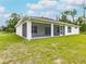 An exterior shot of the back of the home on a sunny day at 17130 Elder St, Port Charlotte, FL 33954