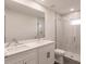 Modern bathroom with double vanity, marble countertop, and frameless glass shower at 17130 Elder St, Port Charlotte, FL 33954