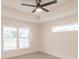Bedroom with a ceiling fan and windows offering great views and natural light at 17130 Elder St, Port Charlotte, FL 33954
