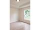 Bright bedroom featuring a large window and light wood flooring at 17130 Elder St, Port Charlotte, FL 33954