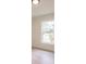 Bright bedroom featuring a large window with a view at 17130 Elder St, Port Charlotte, FL 33954
