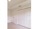 Bright bedroom featuring a closet with paneled doors and light wood flooring at 17130 Elder St, Port Charlotte, FL 33954