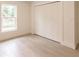 Bedroom featuring a closet with paneled doors and a window with a view at 17130 Elder St, Port Charlotte, FL 33954