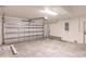 A spacious garage with a steel door and a view to the ceiling at 17130 Elder St, Port Charlotte, FL 33954