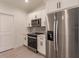 Contemporary kitchen featuring stainless steel appliances and white cabinetry at 17130 Elder St, Port Charlotte, FL 33954