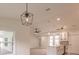 Open concept living space featuring a kitchen and dining area with large windows at 17130 Elder St, Port Charlotte, FL 33954