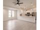 Open-concept living space that joins the kitchen, showcasing modern sliding doors and a ceiling fan at 17130 Elder St, Port Charlotte, FL 33954