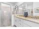 Modern bathroom featuring double vanity and glass shower at 1734 Saddlewood Cir, Port Charlotte, FL 33953