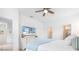 Light-filled bedroom with a TV and access to the bathroom at 1734 Saddlewood Cir, Port Charlotte, FL 33953