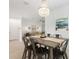 Inviting dining room with open concept and stylish chandelier at 1734 Saddlewood Cir, Port Charlotte, FL 33953