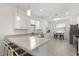 Bright kitchen boasts granite counters, stainless appliances, and bar seating at 1734 Saddlewood Cir, Port Charlotte, FL 33953