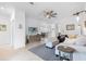 Open-concept living room with neutral colors, tile floors, and ample natural light at 1734 Saddlewood Cir, Port Charlotte, FL 33953
