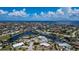 Aerial view of a waterfront residential area with canals and numerous houses at 190 Casa Ln, Punta Gorda, FL 33950
