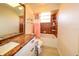 Well-lit bathroom featuring a granite countertop vanity and tiled shower and bathtub area at 190 Casa Ln, Punta Gorda, FL 33950