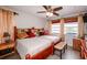This bedroom contains two beds, a ceiling fan, tile floors and lots of natural light at 190 Casa Ln, Punta Gorda, FL 33950