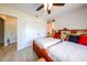 This bedroom contains two beds, a ceiling fan, tile floors, and a closet at 190 Casa Ln, Punta Gorda, FL 33950