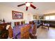 Cozy dining area with seating for six, adjacent to the living room with tile floors and natural light at 190 Casa Ln, Punta Gorda, FL 33950
