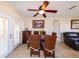 Inviting dining room featuring a ceiling fan and wicker chairs with a dining table at 190 Casa Ln, Punta Gorda, FL 33950