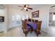 Charming dining area with seating for six, tile floors, and natural light, adjacent to the kitchen at 190 Casa Ln, Punta Gorda, FL 33950