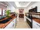 Galley kitchen featuring white cabinets, granite countertops and stainless steel appliances at 190 Casa Ln, Punta Gorda, FL 33950