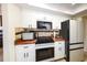 Kitchen featuring stainless steel appliances, granite countertops, and white cabinetry at 190 Casa Ln, Punta Gorda, FL 33950