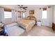 Spacious main bedroom with ceiling fan, wood floors and a decorative headboard at 190 Casa Ln, Punta Gorda, FL 33950
