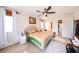 This spacious main bedroom has tile floors, ceiling fan, and a decorative headboard at 190 Casa Ln, Punta Gorda, FL 33950