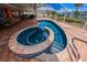 Beautiful kidney shaped pool and spa are surrounded by pavers at 190 Casa Ln, Punta Gorda, FL 33950