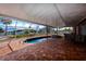 Beautiful backyard with a screened-in patio, pool, and landscaping at 190 Casa Ln, Punta Gorda, FL 33950