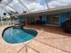 Enclosed pool area with a private swimming pool and a relaxing hot tub, perfect for outdoor enjoyment at 190 Casa Ln, Punta Gorda, FL 33950