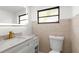 Bathroom featuring a modern vanity, marble countertop, and contemporary fixtures at 19723 Midway Blvd, Port Charlotte, FL 33948