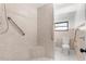 Accessible bathroom with tile shower, grab bars, and comfortable seat at 19723 Midway Blvd, Port Charlotte, FL 33948