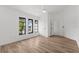 A bright bedroom with light wood flooring and natural lighting from the windows at 19723 Midway Blvd, Port Charlotte, FL 33948
