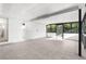 Spacious bonus room with tile flooring, great lighting, and doors to the outside at 19723 Midway Blvd, Port Charlotte, FL 33948